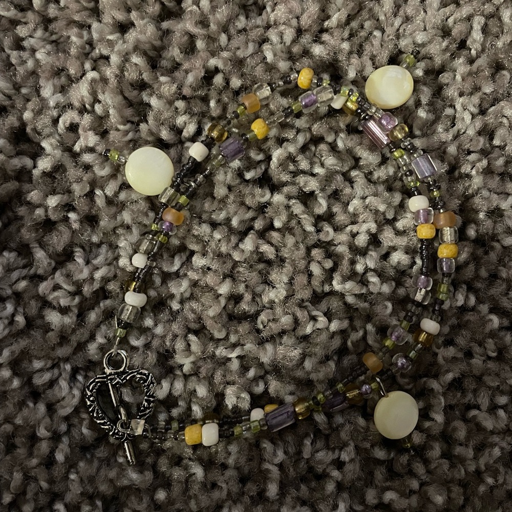 A beautiful homade Bracelet that comes with a matching set of a necklace .